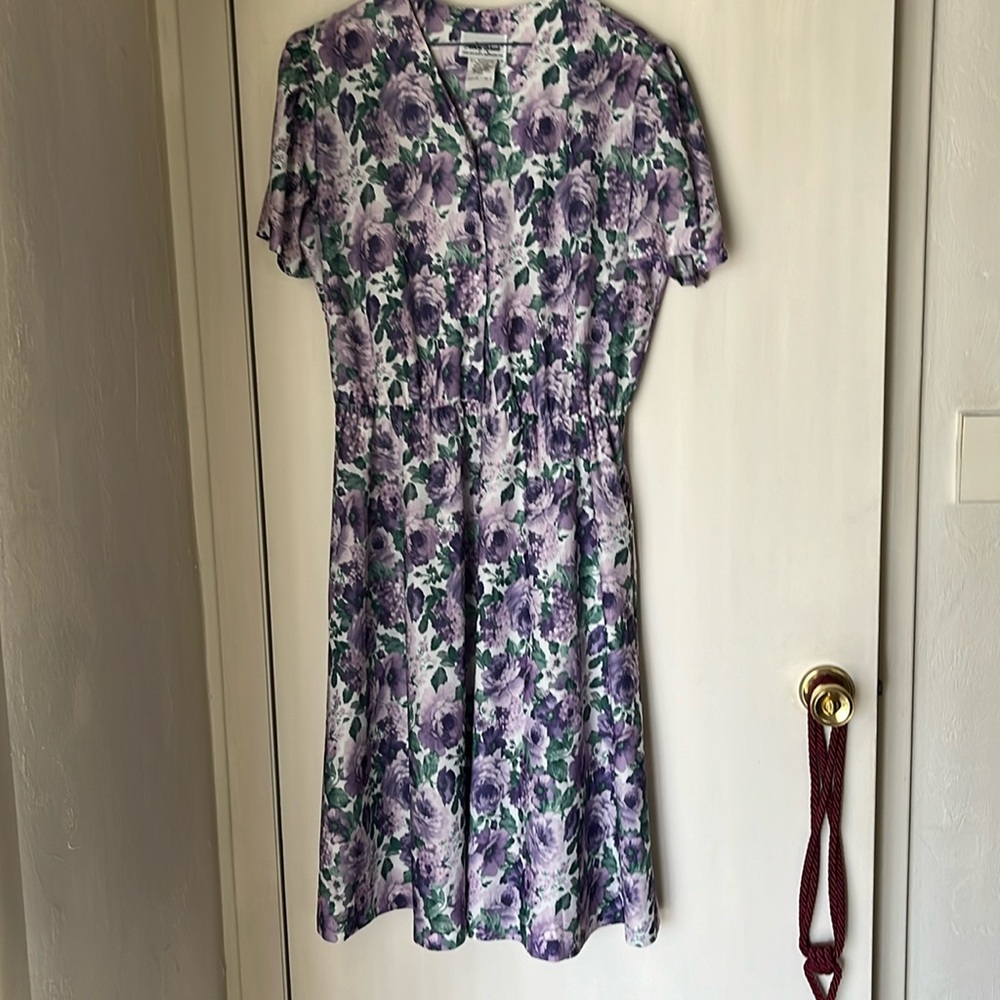 Polyester dress with elastic waist. Front buttons to waist. 14